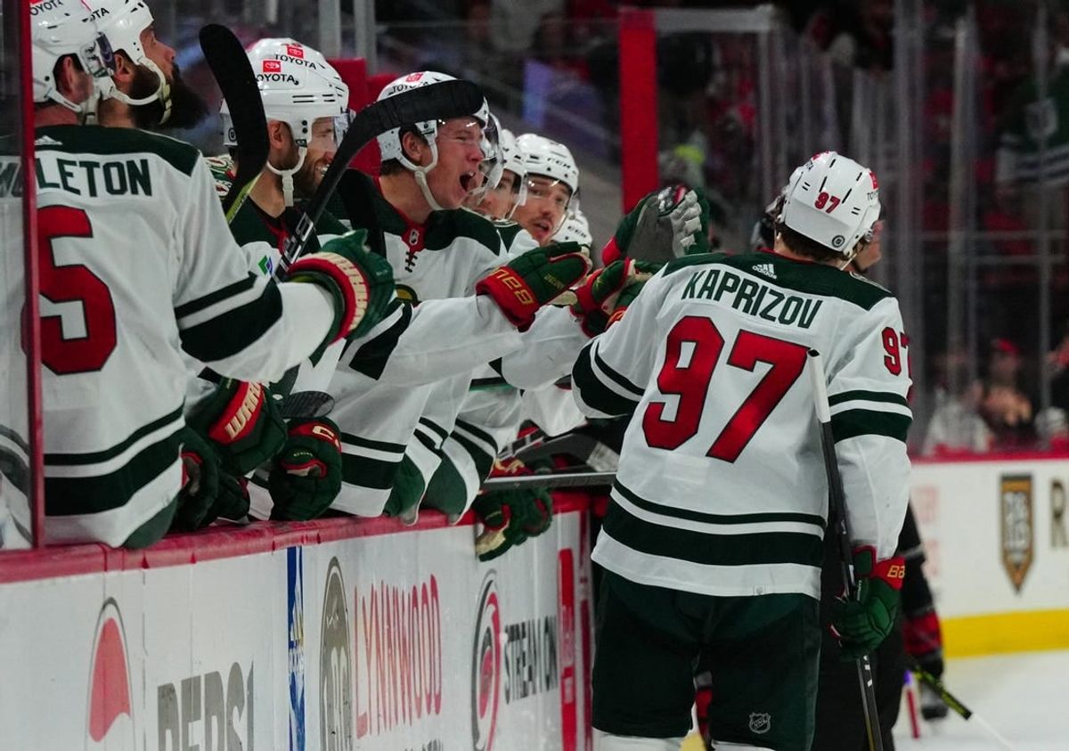 Jan 21, 2024; Raleigh, North Carolina, USA;  Minnesota Wild left wing Kirill Kaprizov (97) celebrates his empty net goal against the Carolina Hurricanes during the third periodat PNC Arena.