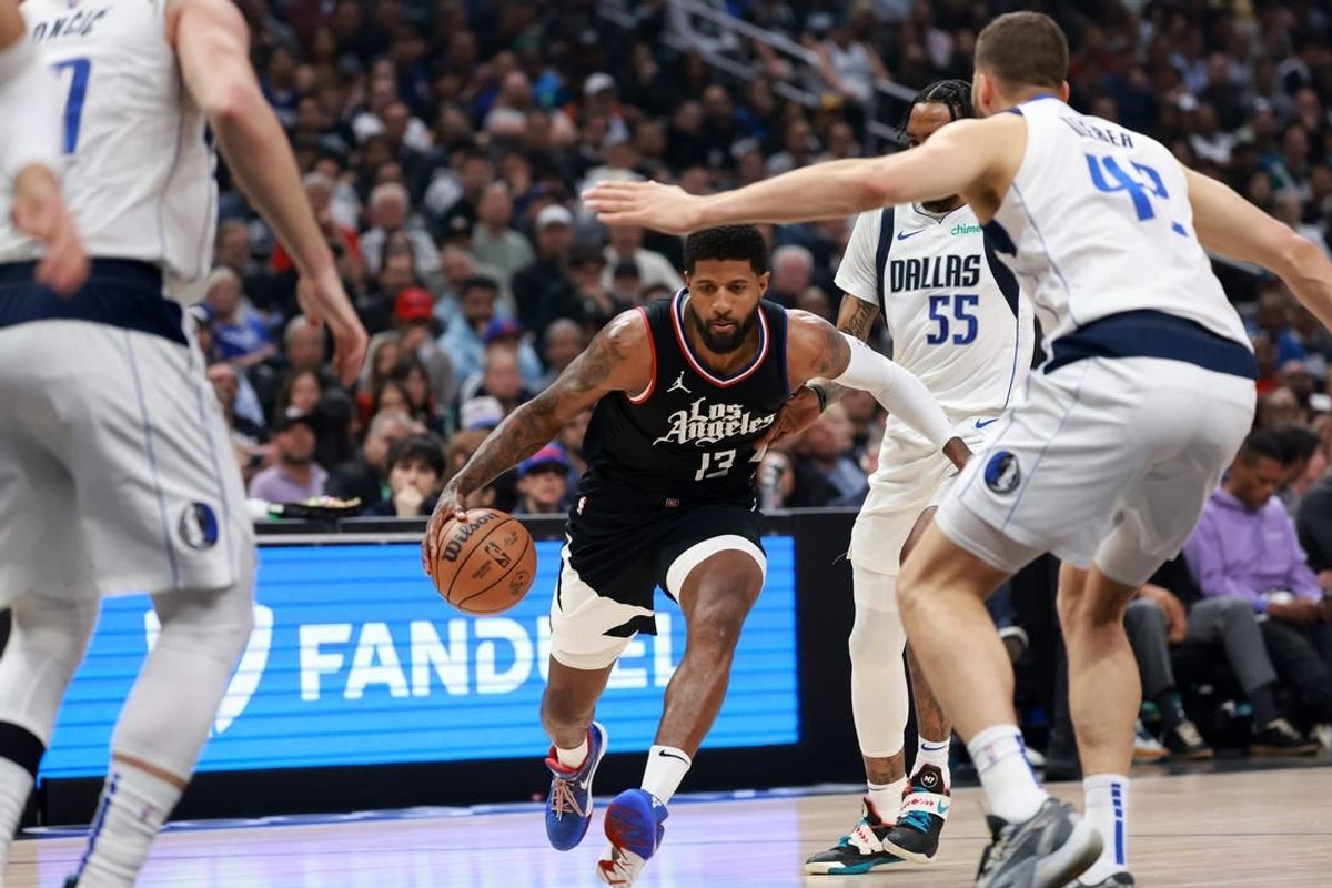 Apr 23, 2024; Los Angeles, California, USA; Los Angeles Clippers forward Paul George (13) drives to the basket against Dallas Mavericks forward Maxi Kleber (42) during the first quarter of game two of the first round for the 2024 NBA playoffs at Crypto.com Arena.