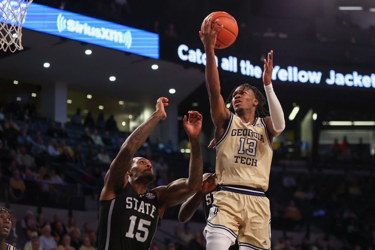 Nov 28, 2023; Atlanta, Georgia, USA; Georgia Tech Yellow Jackets guard Miles Kelly (13) shoots over Mississippi State Bulldogs forward Jimmy Bell Jr. (15) in the second half at McCamish Pavilion.