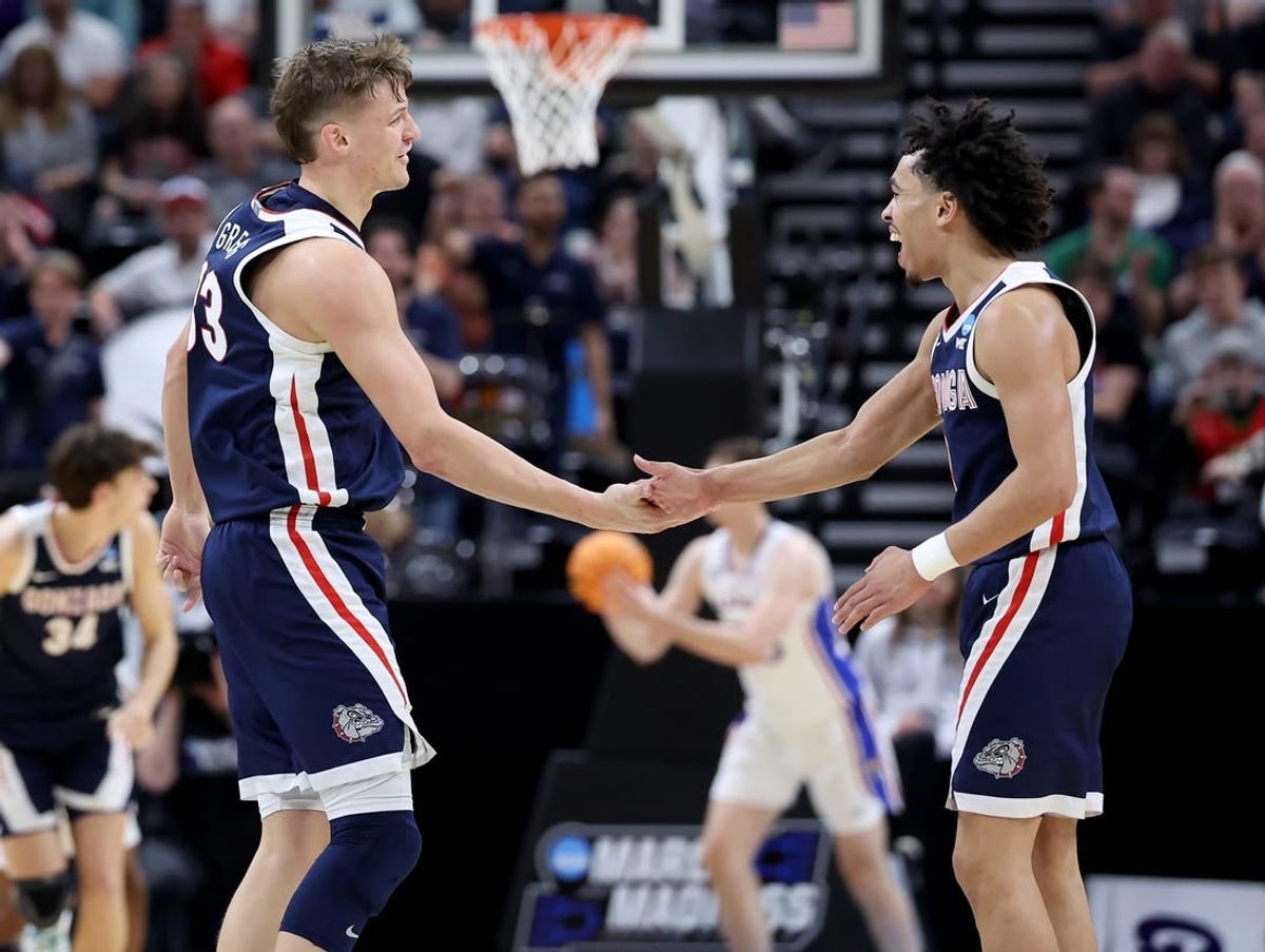 Mar 23, 2024; Salt Lake City, UT, USA; Gonzaga Bulldogs forward Ben Gregg (33) and guard Ryan Nembhard (0) celebrate during the second half in the second round of the 2024 NCAA Tournament against the Kansas Jayhawks at Vivint Smart Home Arena-Delta Center.