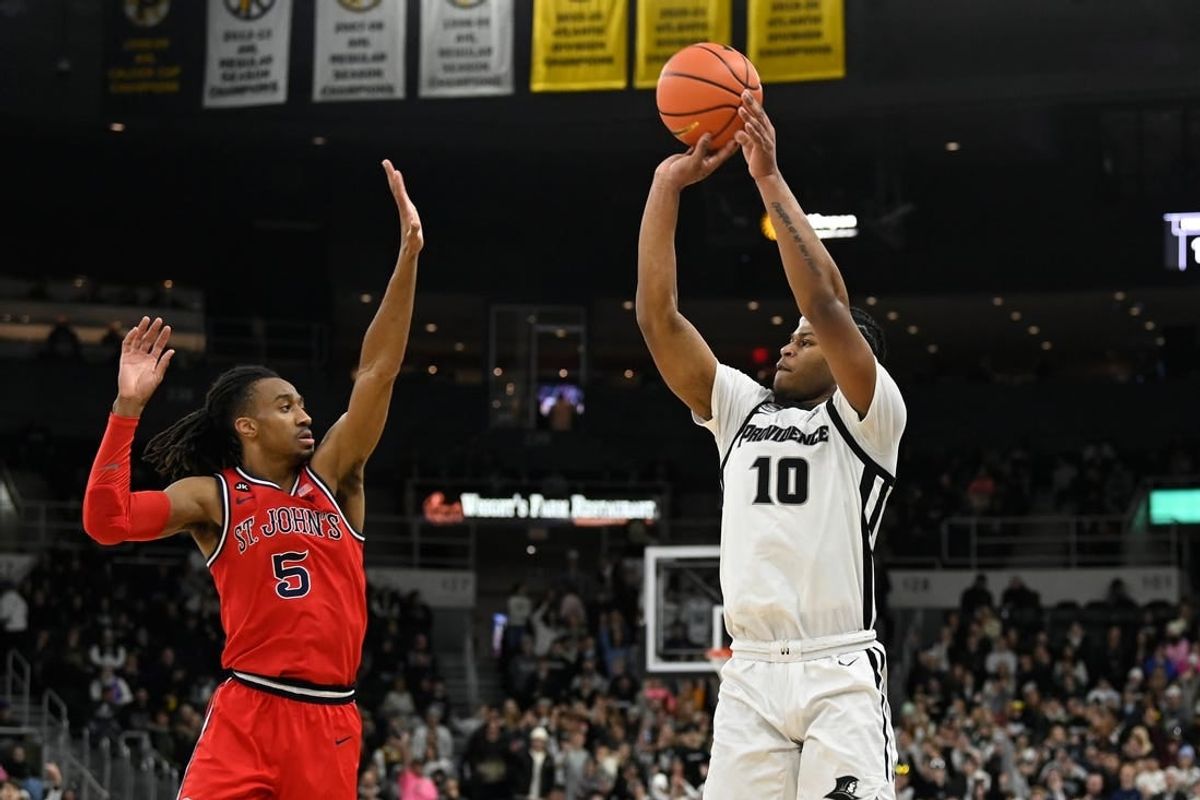 Feb 13, 2024; Providence, Rhode Island, USA; Providence Friars forward Rich Barron (10) shoots the ball over St. John's Red Storm guard Daniss Jenkins (5) during the first half at Amica Mutual Pavilion.