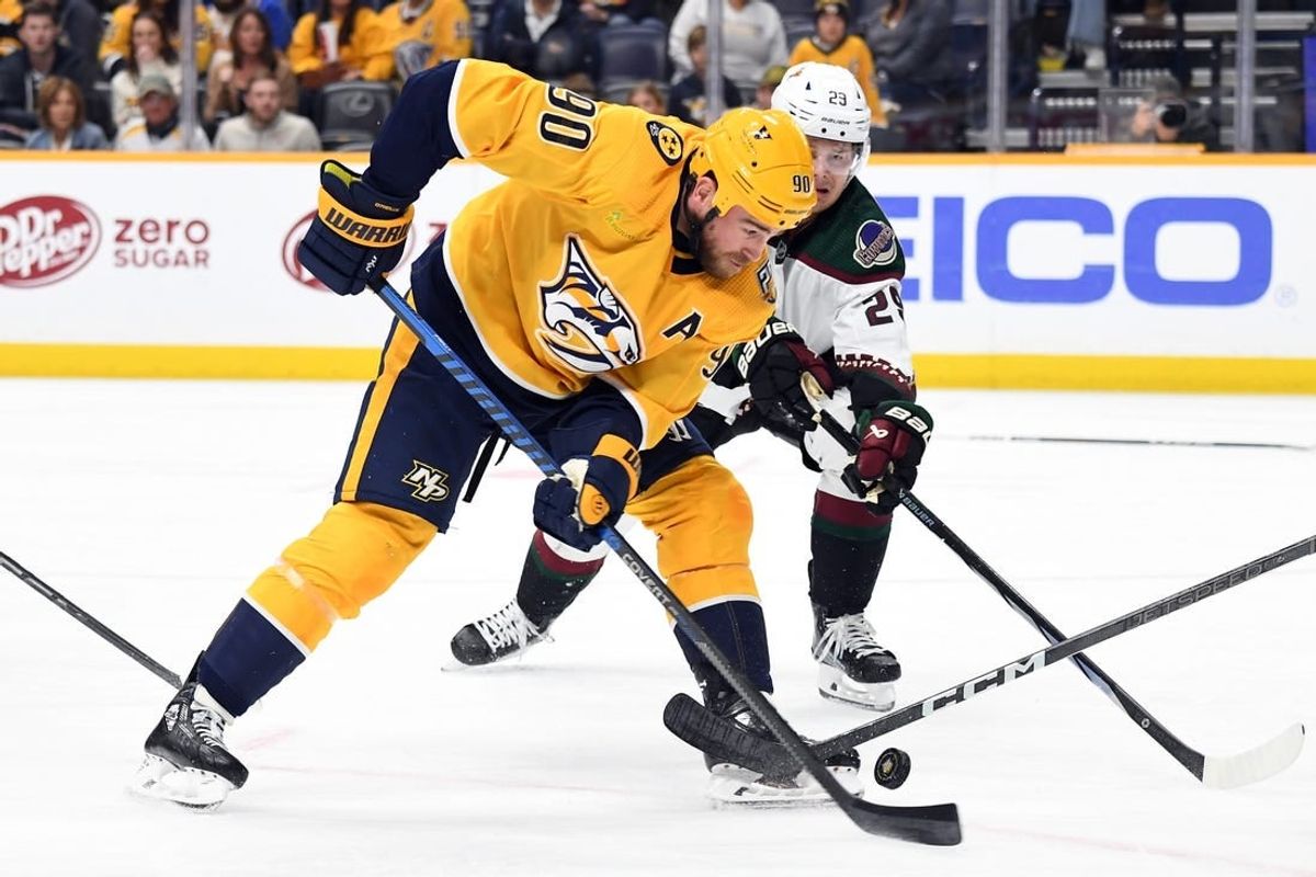 Nov 11, 2023; Nashville, Tennessee, USA; Nashville Predators center Ryan O'Reilly (90) handles the puck during the first period against the Arizona Coyotes at Bridgestone Arena.