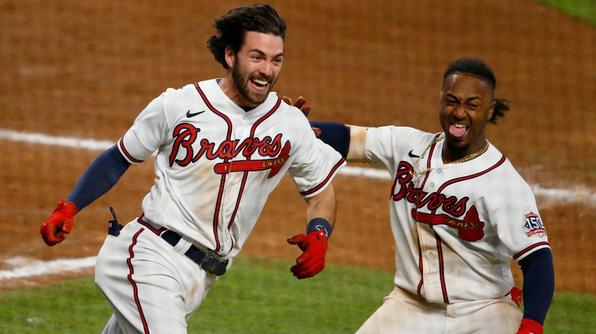 Dansby Swa nson and Ozzie Albies celebrate interesting baseball.