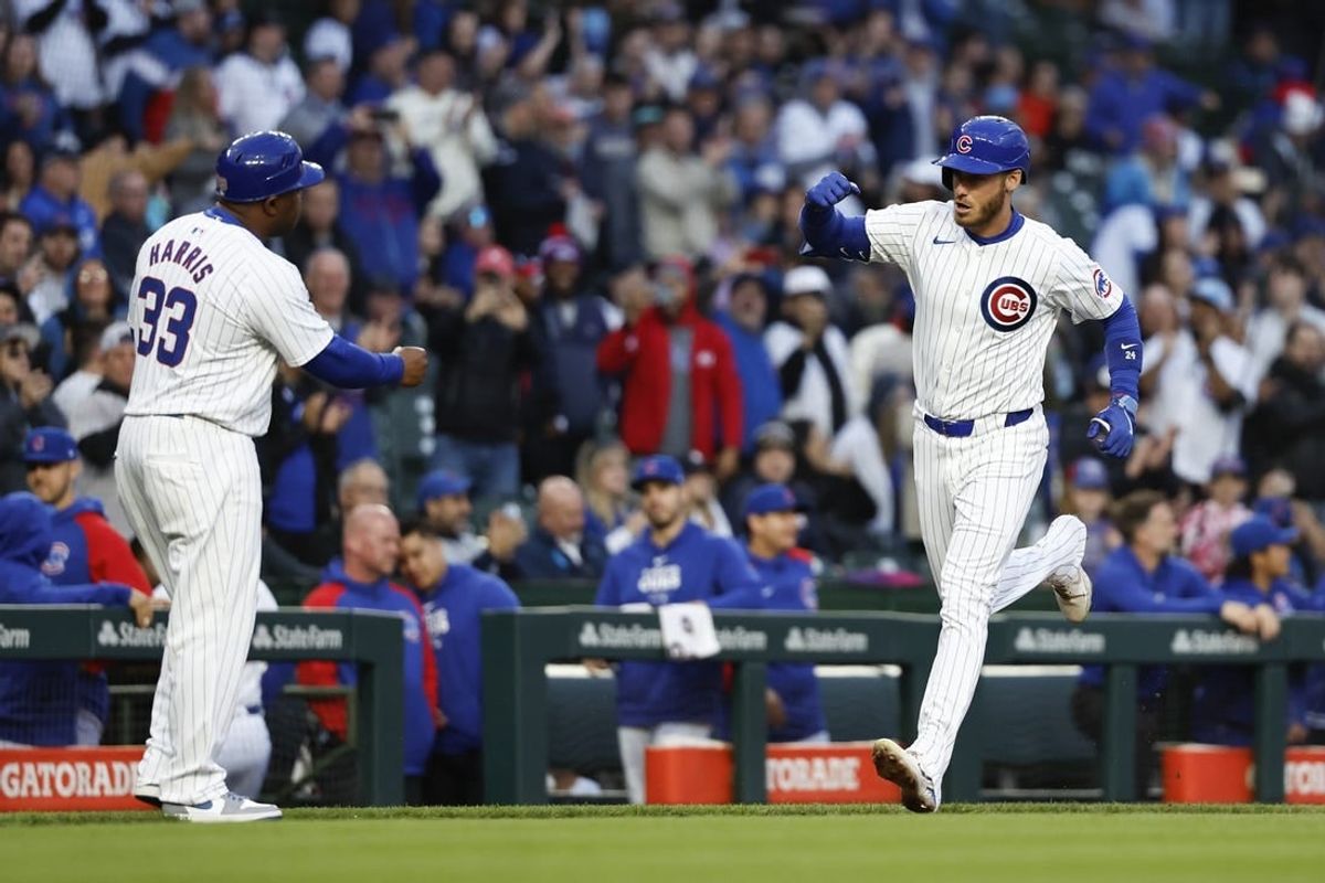 Apr 23, 2024; Chicago, Illinois, USA; Chicago Cubs outfielder Cody Bellinger (24) rounds the bases after hitting a two-run home run against the Houston Astros during the first inning at Wrigley Field.