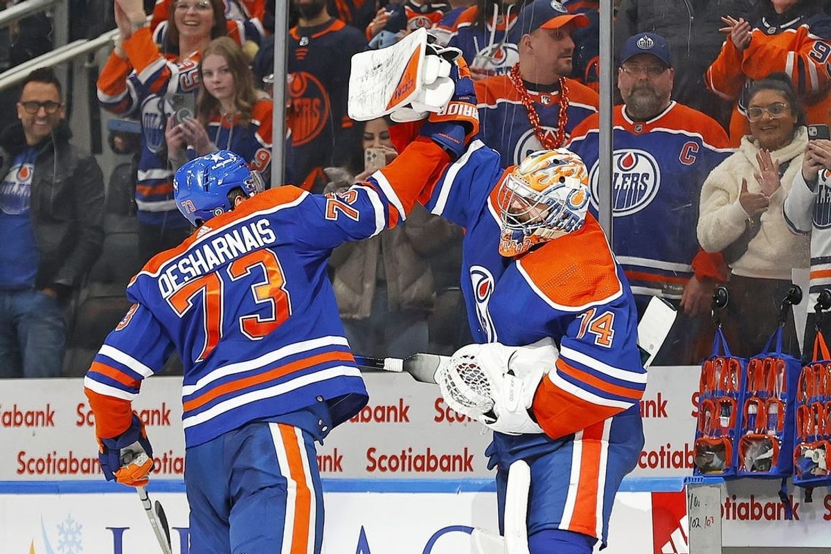 Jan 27, 2024; Edmonton, Alberta, CAN; Edmonton Oilers defensemen Vincent Desharnais (73) and goaltender Stuart Skinner (74) celebrate the Oilers 4-1 victory over the Nashville Predators. It is the Oilers 16th straight win at Rogers Place.