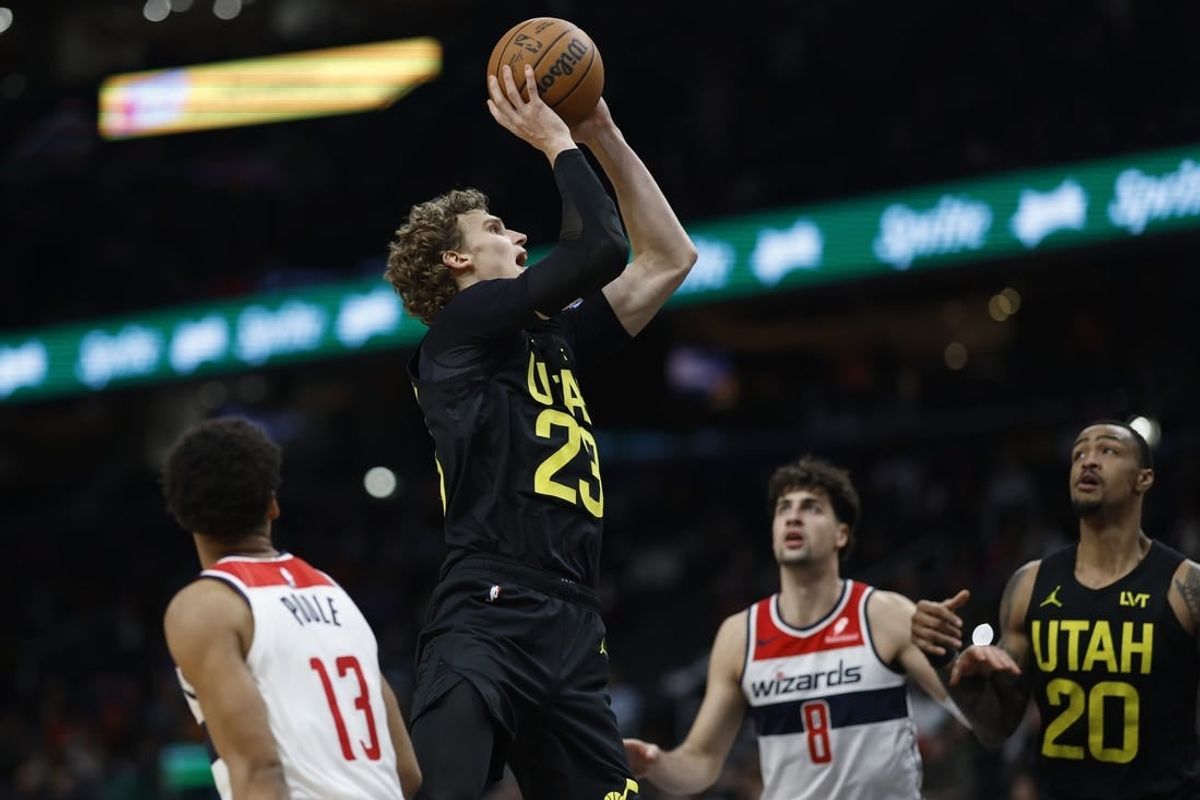 Jan 25, 2024; Washington, District of Columbia, USA; Utah Jazz forward Lauri Markkanen (23) shoots the ball as Washington Wizards forward Deni Avdija (8) looks on in the second half at Capital One Arena.
