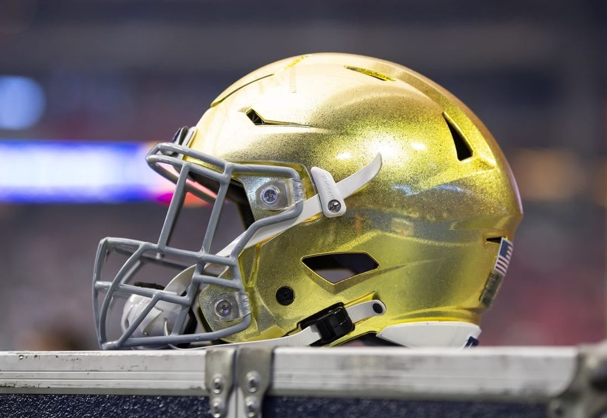Jan 1, 2022; Glendale, Arizona, USA; Detailed view of a gold Notre Dame Fighting Irish helmet during the 2022 Fiesta Bowl at State Farm Stadium.