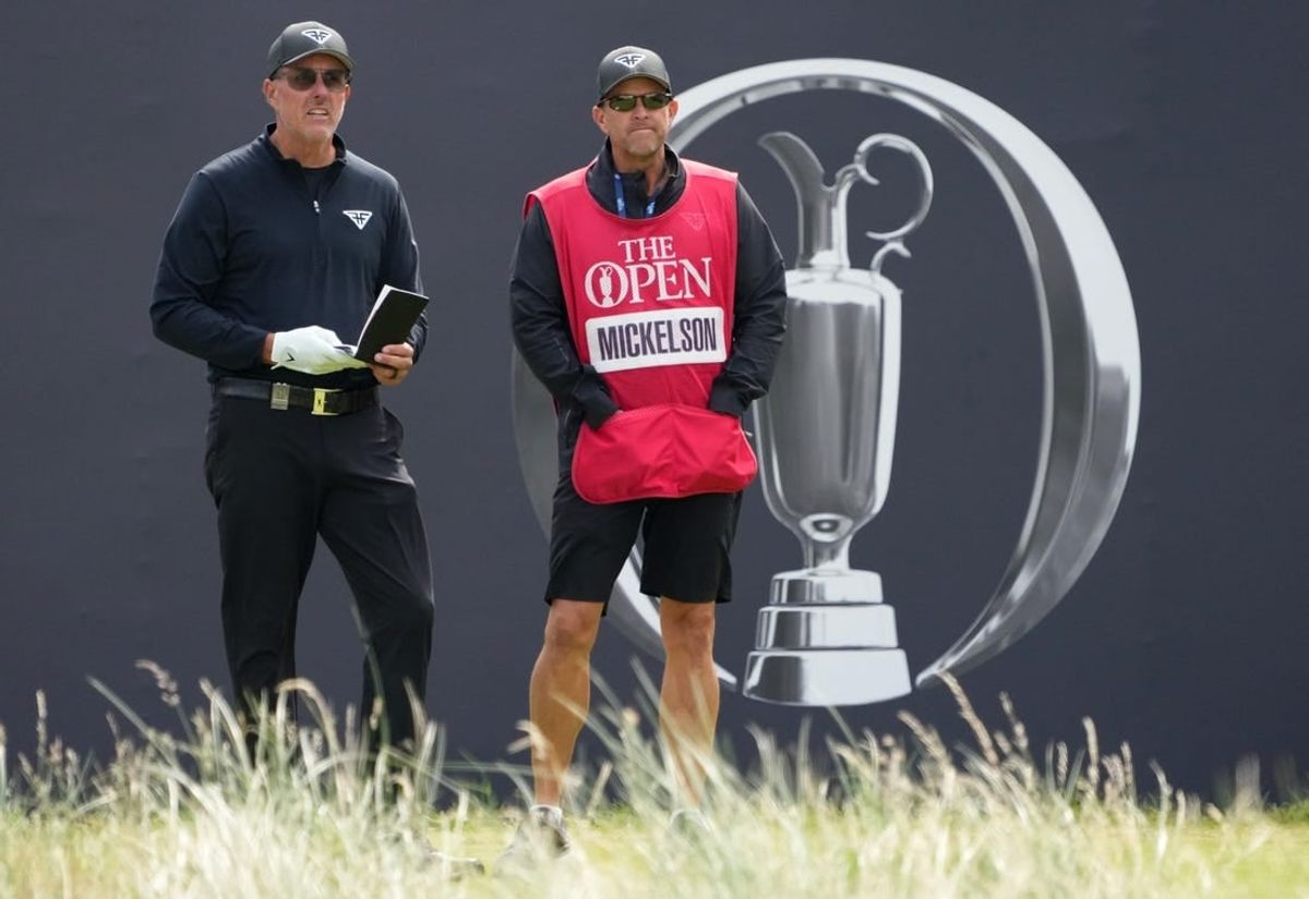 July 21, 2023; Hoylake, ENGLAND, GBR; Phil Mickelson (LIV player) and his caddie Tim Mickelson on the first hole during the second round of The Open Championship golf tournament at Royal Liverpool.