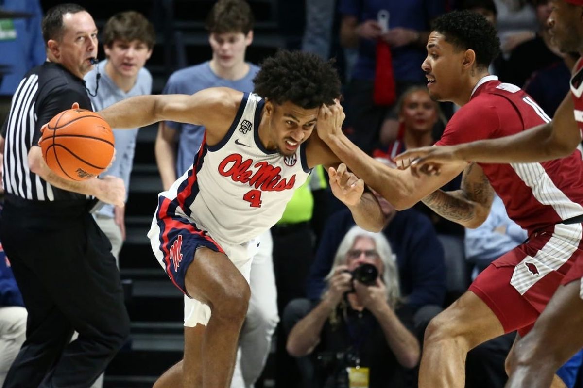Jan 24, 2024; Oxford, Mississippi, USA; Mississippi Rebels forward Jaemyn Brakefield (4) drives to the basket as Arkansas Razorbacks forward Jalen Graham (11) defends during the first half at The Sandy and John Black Pavilion at Ole Miss.