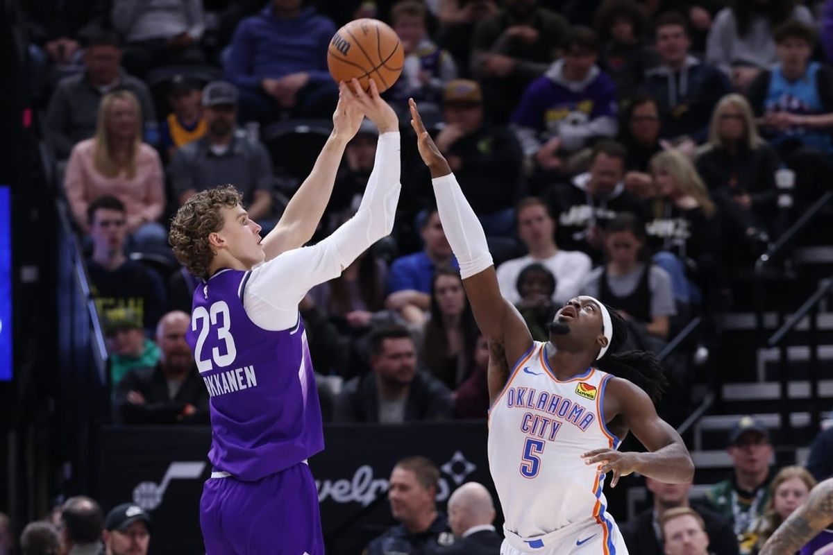 Feb 6, 2024; Salt Lake City, Utah, USA; Utah Jazz forward Lauri Markkanen (23) shoots over Oklahoma City Thunder guard Luguentz Dort (5) during the second quarter at Delta Center.