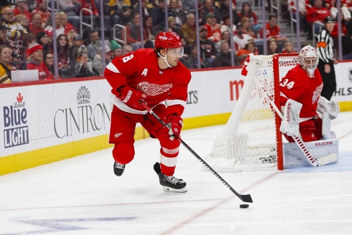 Dec 31, 2023; Detroit, Michigan, USA; Detroit Red Wings defenseman Ben Chiarot (8) handles the puck during the third period of the game against the Boston Bruins at Little Caesars Arena.