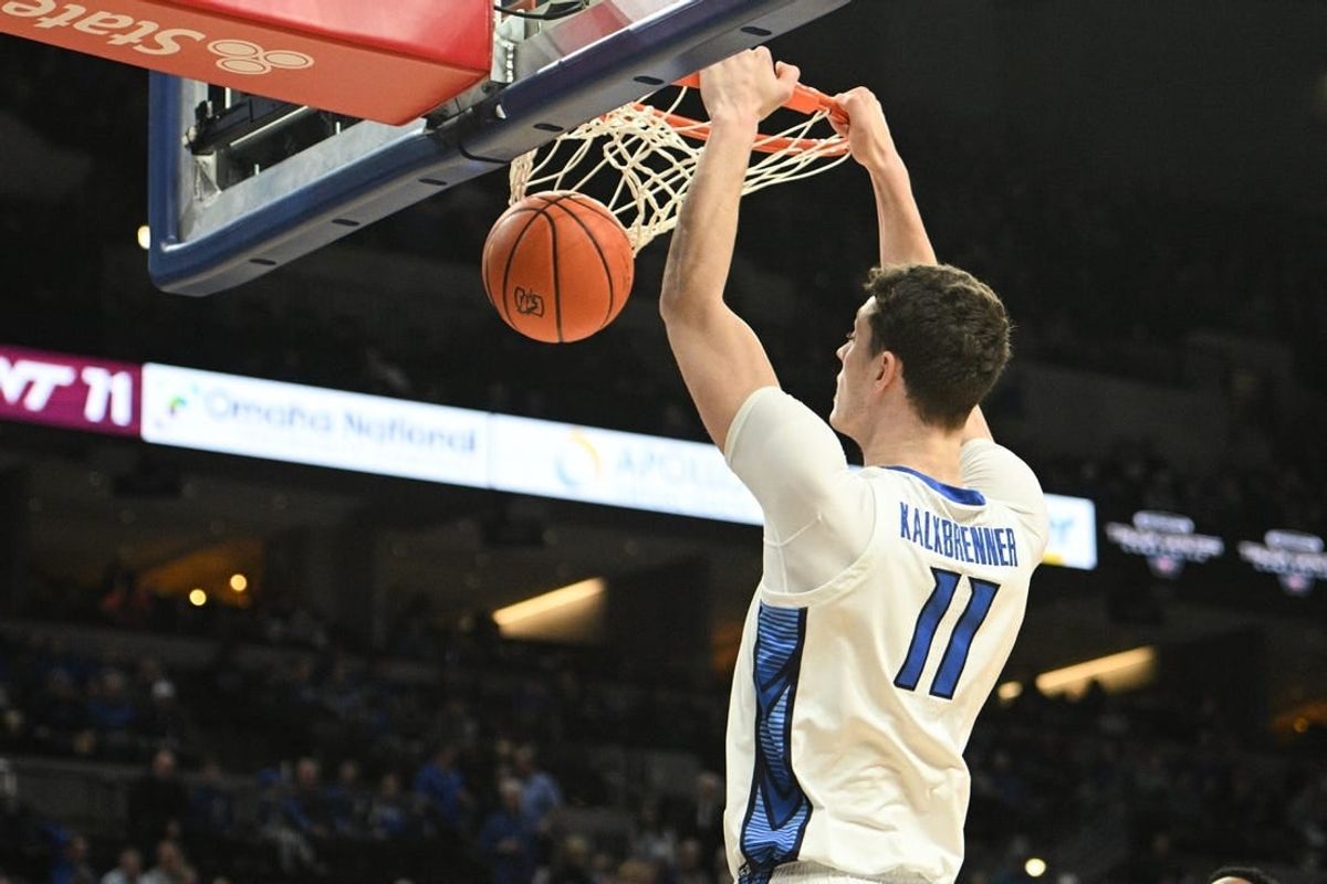 Dec 9, 2023; Omaha, Nebraska, USA;  Creighton Bluejays center Ryan Kalkbrenner (11) dunks against the Central Michigan Chippewas in the second half at CHI Health Center Omaha.
