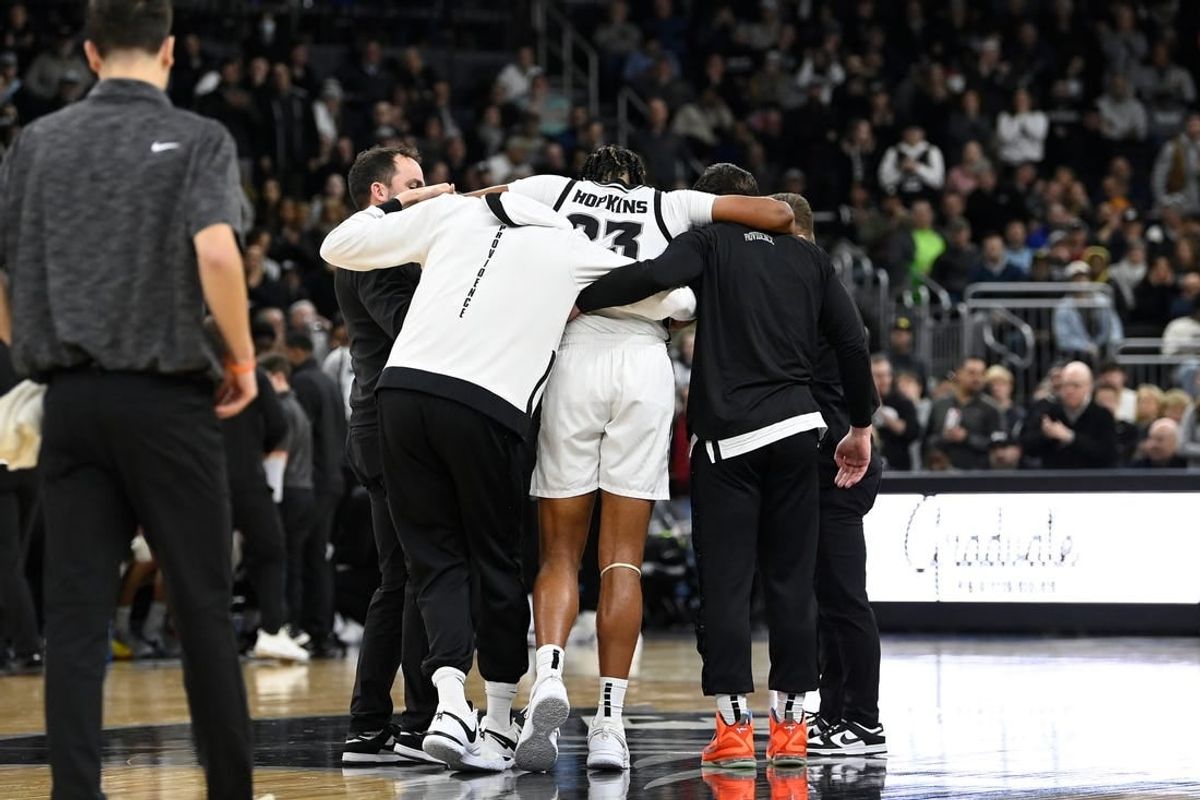 Jan 3, 2024; Providence, Rhode Island, USA; Providence Friars forward Bryce Hopkins (23) is helped by staff after getting injured during the second half against the Seton Hall Pirates at Amica Mutual Pavilion.