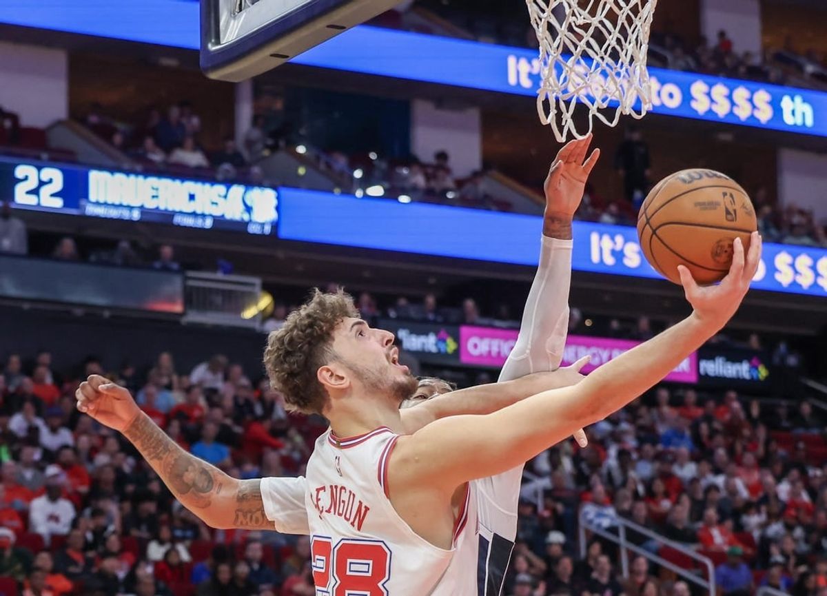Dec 22, 2023; Houston, Texas, USA; Houston Rockets center Alperen Sengun (28) scores against Dallas Mavericks forward Markieff Morris (88) in the second quarter at Toyota Center.