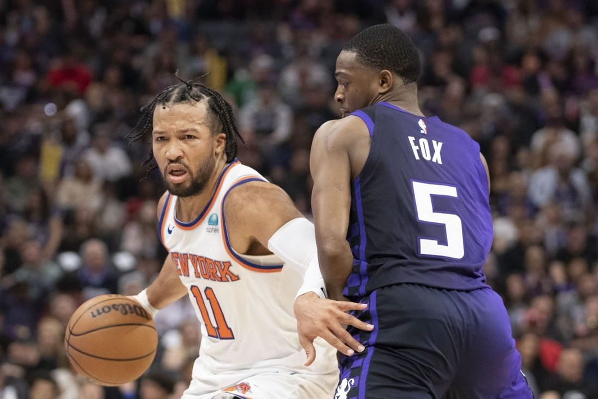 March 16, 2024; Sacramento, California, USA; New York Knicks guard Jalen Brunson (11) dribbles the basketball against Sacramento Kings guard De'Aaron Fox (5) during the second quarter at Golden 1 Center.