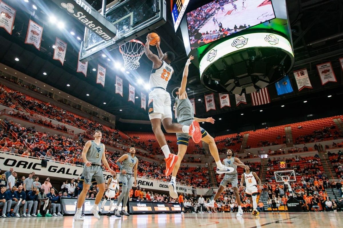 Jan 27, 2024; Stillwater, Oklahoma, USA; Oklahoma State Cowboys center Brandon Garrison (23) puts up a shot against the West Virginia Mountaineers during the first half at Gallagher-Iba Arena.