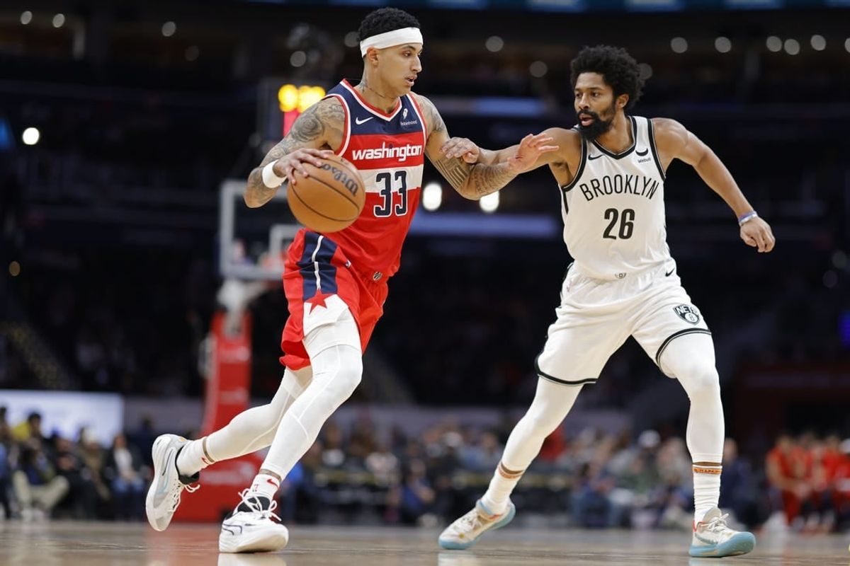 Dec 29, 2023; Washington, District of Columbia, USA; Washington Wizards forward Kyle Kuzma (33) dribbles the ball as Brooklyn Nets guard Spencer Dinwiddie (26) defends in the second quarter at Capital One Arena.