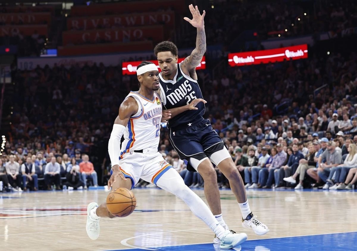 Mar 14, 2024; Oklahoma City, Oklahoma, USA; Oklahoma City Thunder guard Shai Gilgeous-Alexander (2) drives to the basket beside Dallas Mavericks forward P.J. Washington (25) during the second half at Paycom Center.