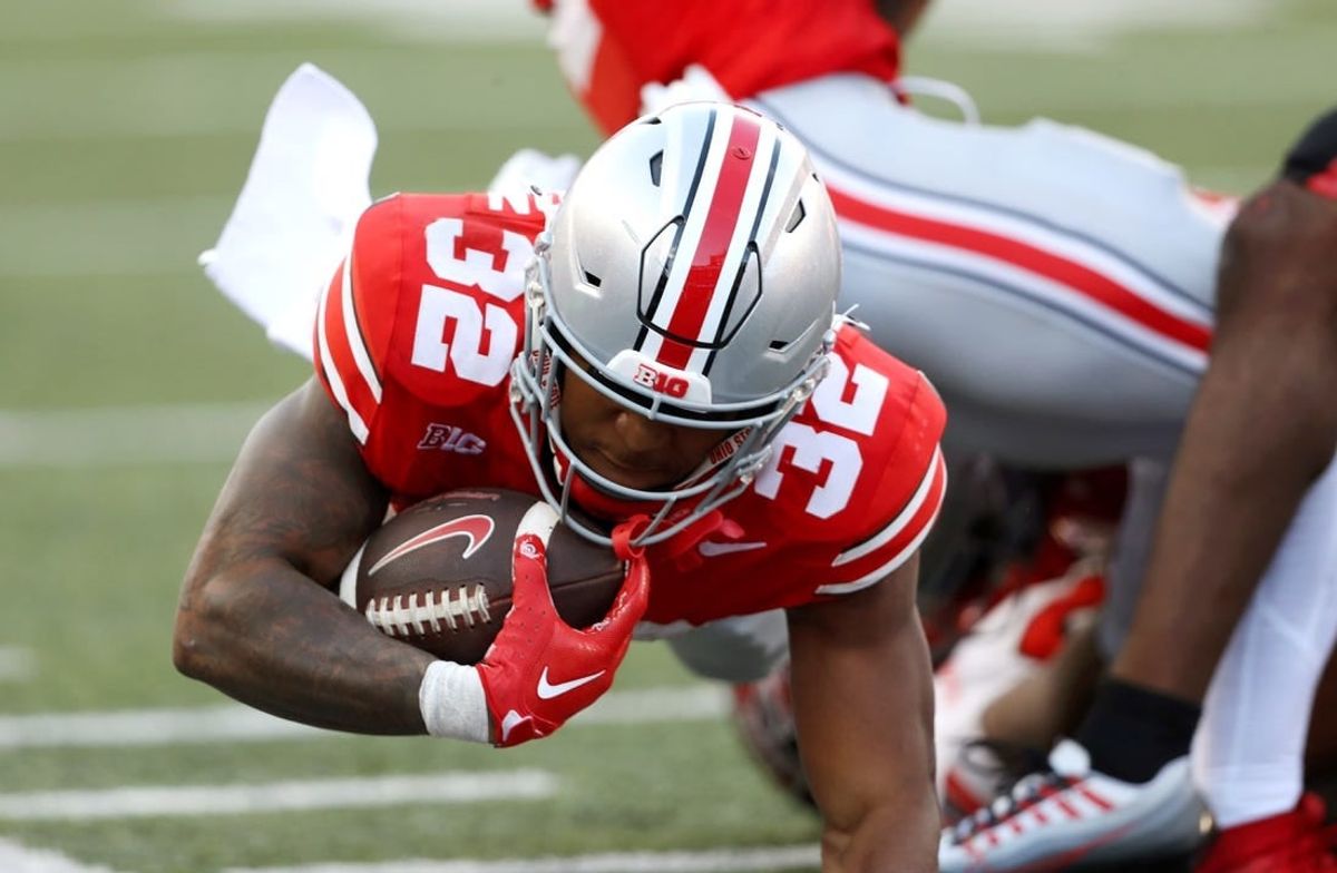 Sep 16, 2023; Columbus, Ohio, USA; Ohio State Buckeyes running back TreVeyon Henderson (32) runs during the second quarter against the Western Kentucky Hilltoppers at Ohio Stadium.