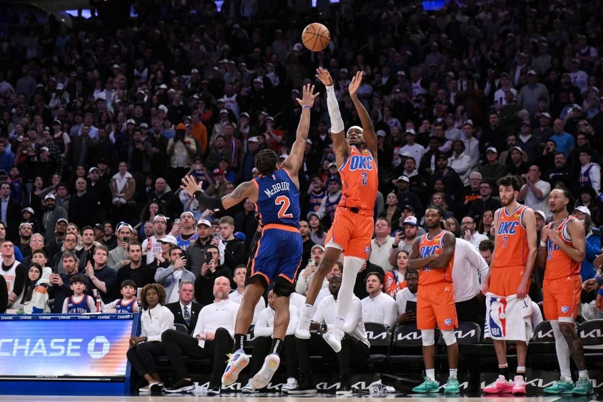 Mar 31, 2024; New York, New York, USA; Oklahoma City Thunder guard Shai Gilgeous-Alexander (2) hits the game winning basket with 1.8 seconds remaining in the fourth quarter while being defended by New York Knicks guard Miles McBride (2) at Madison Square Garden.