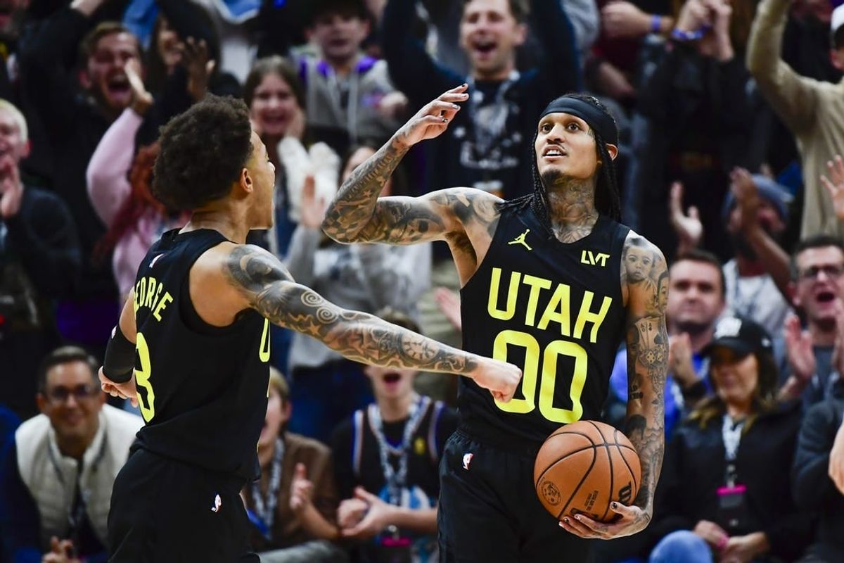 Jan 1, 2024; Salt Lake City, Utah, USA; Utah Jazz guard Jordan Clarkson (00) reacts after recovering a rebound for a record breaking triple-double against the Dallas Mavericks during the second half at the Delta Center.