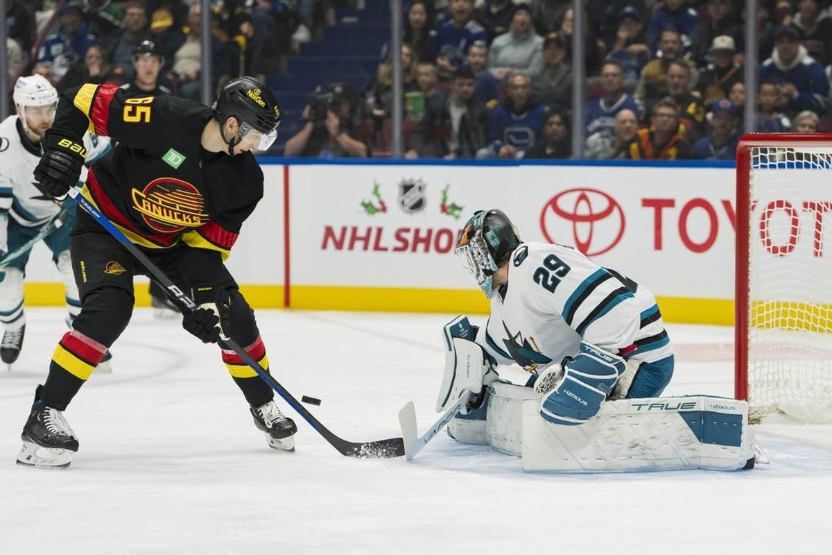 Nov 20, 2023; Vancouver, British Columbia, CAN; San Jose Sharks goalie Mackenzie Blackwood (29) makes a save on Vancouver Canucks forward Ilya Mikheyev (65) at Rogers Arena.