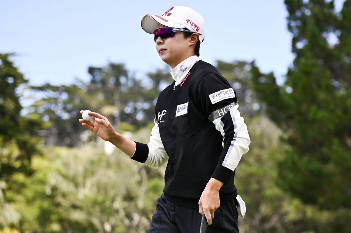Jul 9, 2023; Pebble Beach, California, USA; Hyo Joo Kim acknowledges the crowd after her putt on the second hole  during the final round of the U.S. Women's Open golf tournament at Pebble Beach Golf Links.