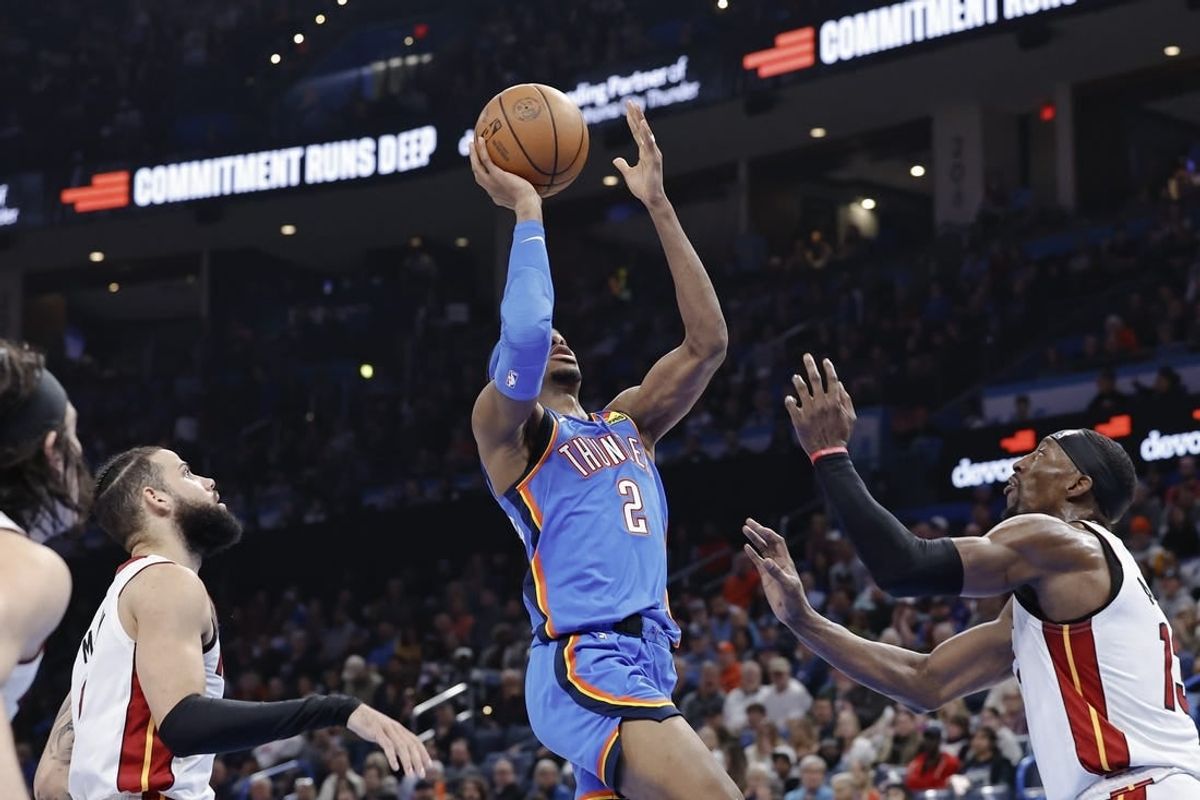 Mar 8, 2024; Oklahoma City, Oklahoma, USA; Oklahoma City Thunder guard Shai Gilgeous-Alexander (2) shoots in front of Miami Heat center Bam Adebayo (13) during the second half at Paycom Center.