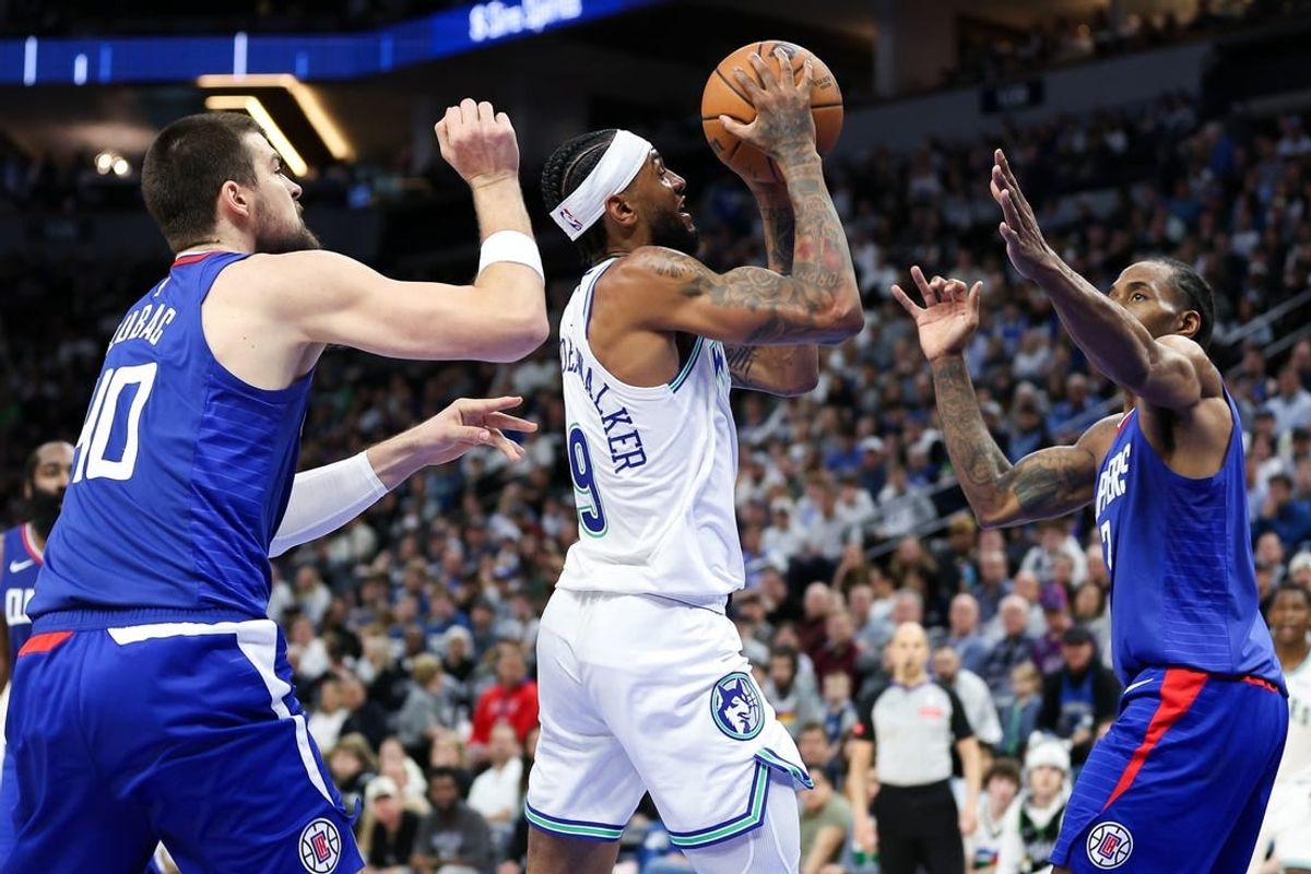 Mar 3, 2024; Minneapolis, Minnesota, USA; Minnesota Timberwolves guard Nickeil Alexander-Walker (9) shoots as LA Clippers center Ivica Zubac (40) and LA Clippers forward Kawhi Leonard (2) defend during the first half at Target Center.