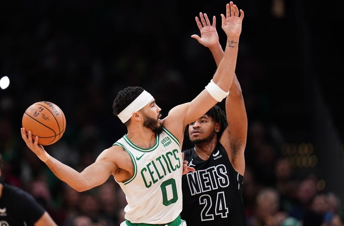 Feb 14, 2024; Boston, Massachusetts, USA; Boston Celtics forward Jayson Tatum (0) looks for an opening against Brooklyn Nets guard Cam Thomas (24) in the second half at TD Garden.