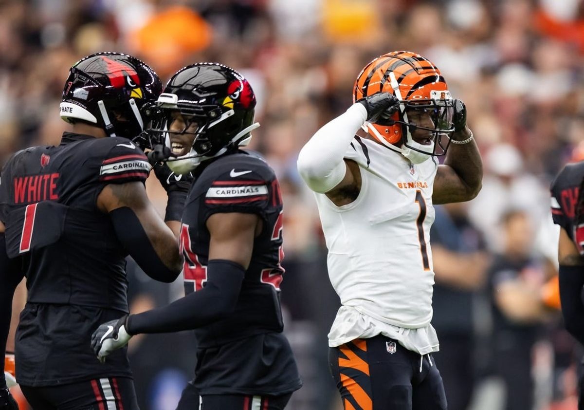 Oct 8, 2023; Glendale, Arizona, USA; Cincinnati Bengals wide receiver Ja'Marr Chase (1) flexes as he celebrates a first down against the Arizona Cardinals in the first half at State Farm Stadium.