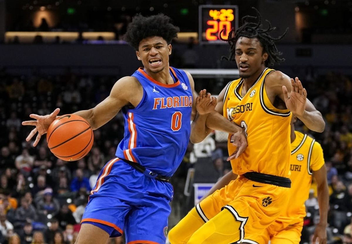 Jan 20, 2024; Columbia, Missouri, USA; Florida Gators guard Zyon Pullin (0) drives against Missouri Tigers forward Aidan Shaw (23) during the second half at Mizzou Arena.