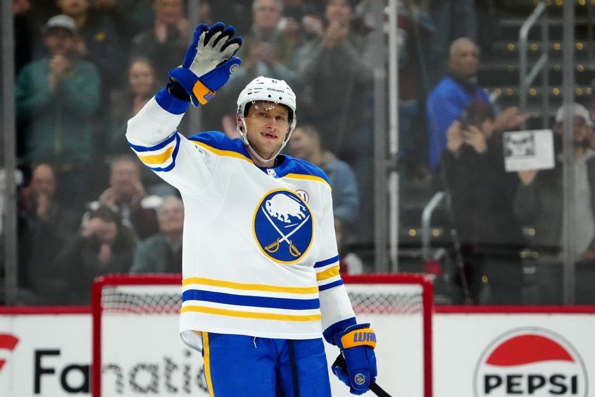 Dec 13, 2023; Denver, Colorado, USA; Buffalo Sabres defenseman Erik Johnson (6) waves to the Colorado Avalanche fans during the first period at Ball Arena.