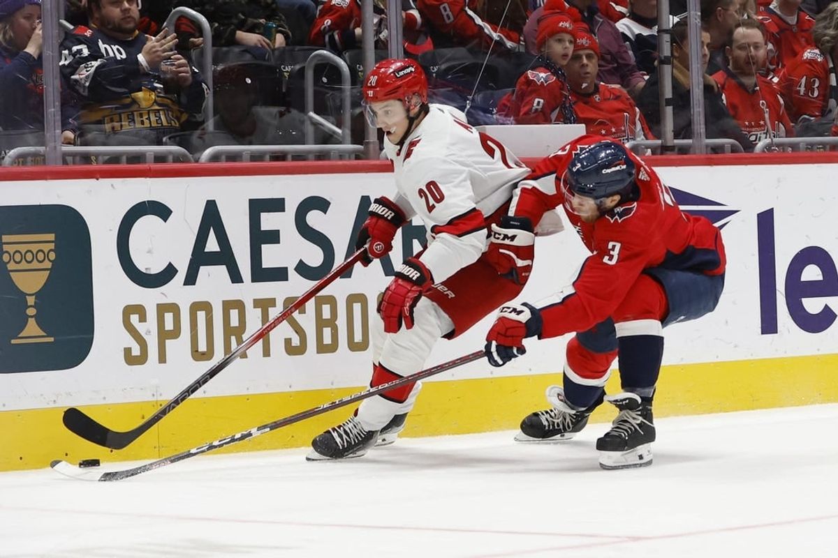 Jan 5, 2024; Washington, District of Columbia, USA; Carolina Hurricanes center Sebastian Aho (20) skates with the puck as Washington Capitals defenseman Nick Jensen (3) chases in the second period at Capital One Arena.