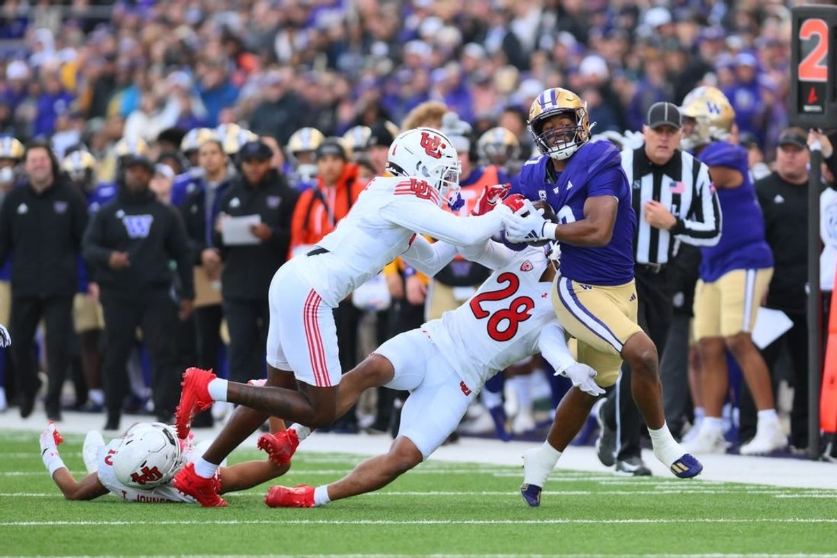 Nov 11, 2023; Seattle, Washington, USA; Washington Huskies running back Dillon Johnson (7) carries the ball after a catch against the Utah Utes during the first half at Alaska Airlines Field at Husky Stadium.