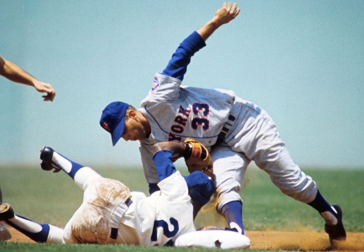 1966; Los Angeles, CA, USA: FILE PHOTO; Los Angeles Dodgers short stop Nate Oliver (29) holds the ball up after New York Mets second baseman Ron Hunt (33) makes it to second base at Dodger Stadium. Mandatory Credit: Darryl Norenberg-Imagn Images