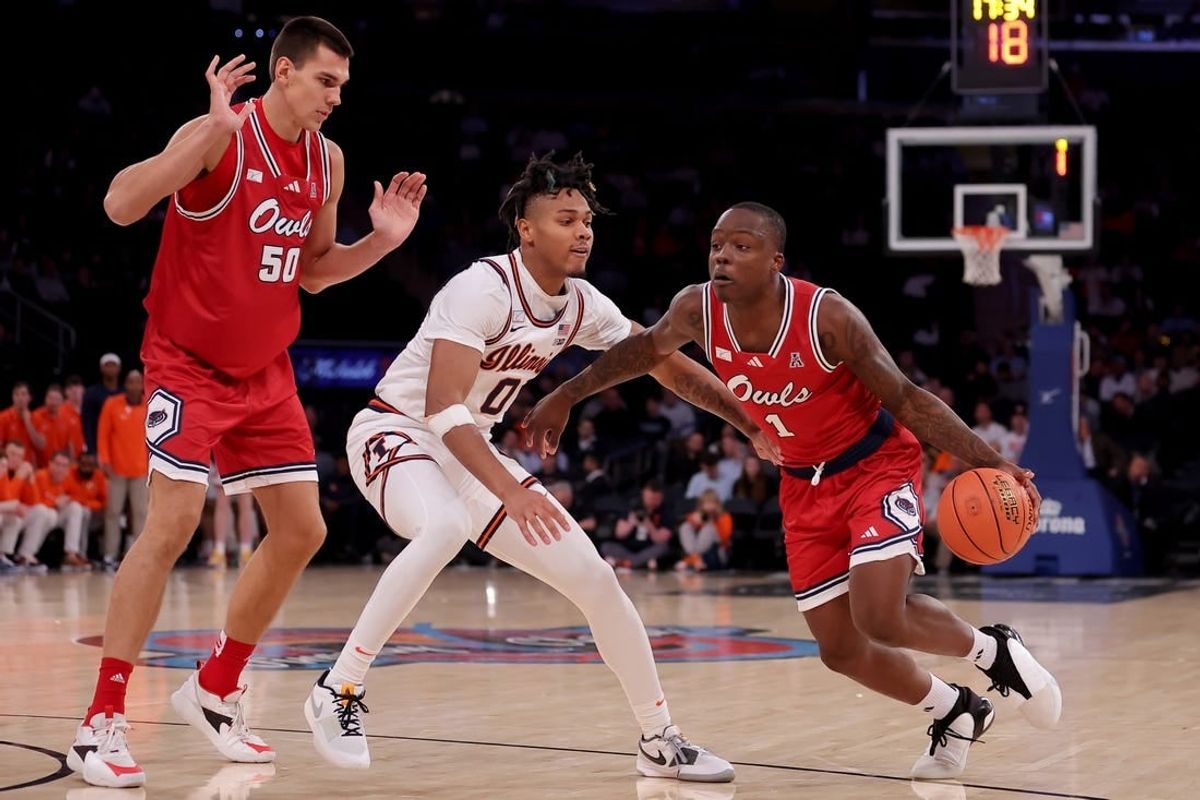 Dec 5, 2023; New York, New York, USA; Florida Atlantic Owls guard Johnell Davis (1) drives to the basket against Illinois Fighting Illini guard Terrence Shannon Jr. (0) in front of Owls center Vladislav Goldin (50) during the second half at Madison Square Garden.