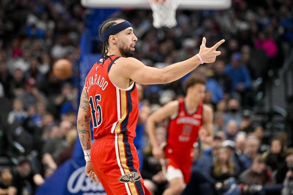 Jan 13, 2024; Dallas, Texas, USA; New Orleans Pelicans forward Larry Nance Jr. (22) celebrates making a three point basket against the Dallas Mavericks during the first quarter at the American Airlines Center.