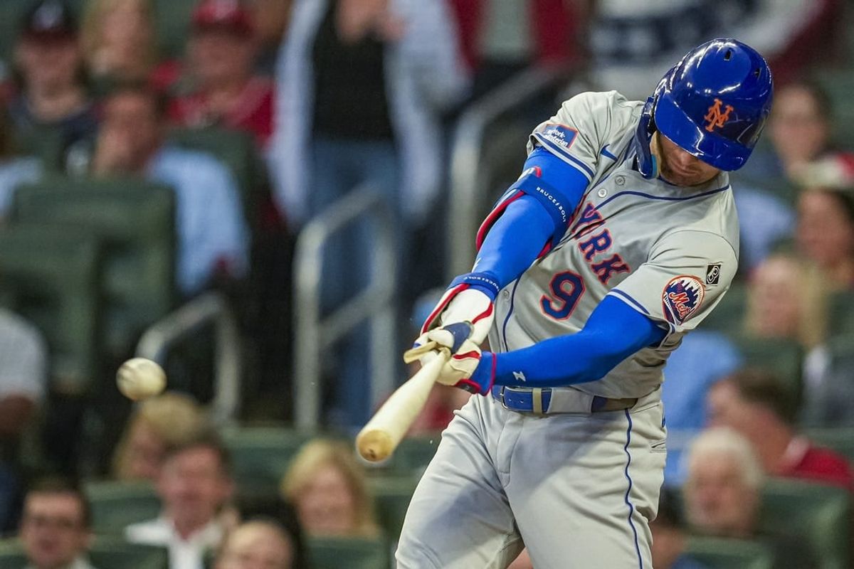 Apr 8, 2024; Cumberland, Georgia, USA; New York Mets left fielder Brandon Nimmo (9) gets a lead off single against the Atlanta Braves during the first inning at Truist Park.