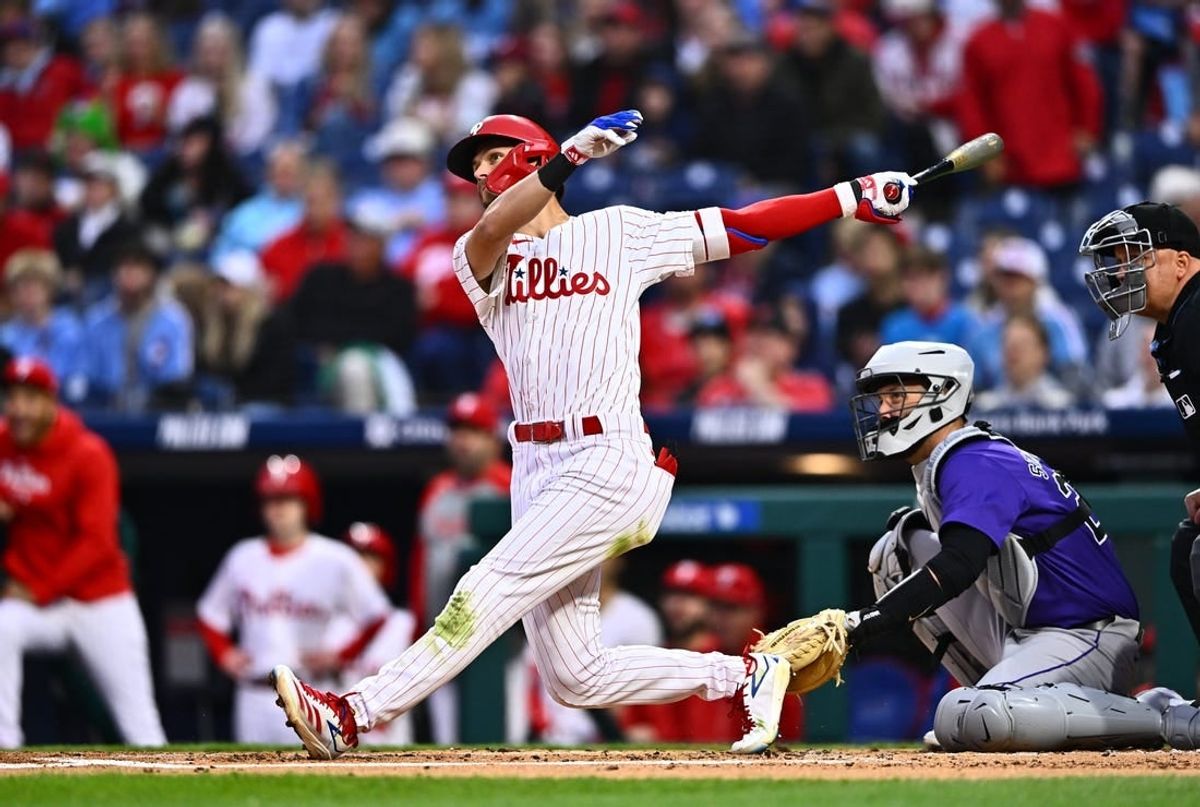 Apr 17, 2024; Philadelphia, Pennsylvania, USA; Philadelphia Phillies shortstop Trea Turner (7) hits a home run against the Colorado Rockies in the first inning at Citizens Bank Park.