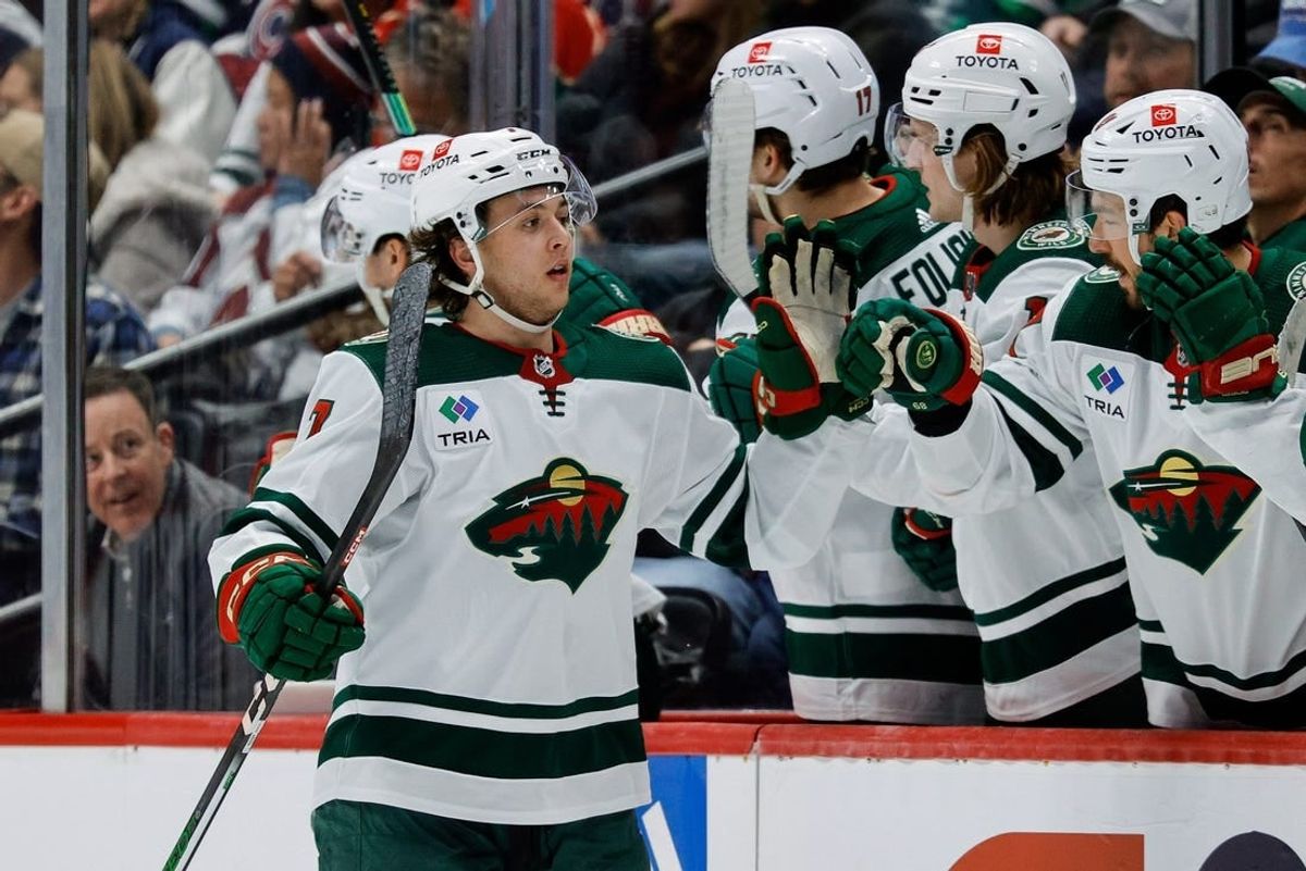 Mar 8, 2024; Denver, Colorado, USA; Minnesota Wild defenseman Brock Faber (7) celebrates with the bench after his goal in the second period against the Colorado Avalanche at Ball Arena.
