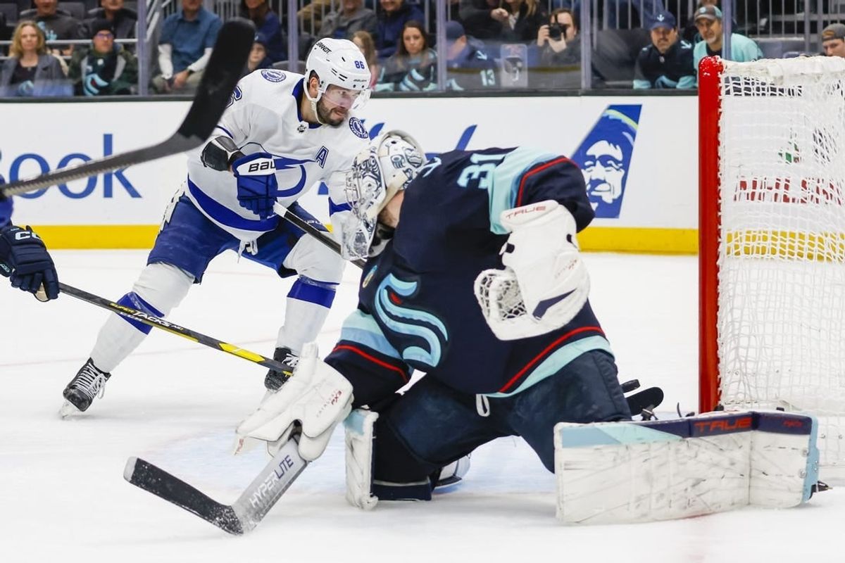 Dec 9, 2023; Seattle, Washington, USA; Tampa Bay Lightning right wing Nikita Kucherov (86) scores a goal against Seattle Kraken goaltender Philipp Grubauer (31) during the first period at Climate Pledge Arena.