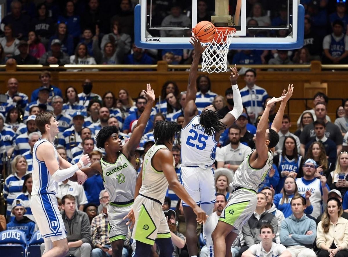 Dec 30, 2023; Durham, North Carolina, USA; Duke Blue Devils forward Mark Mitchell (25) shoots during the first half against the Queens Royals at Cameron Indoor Stadium.