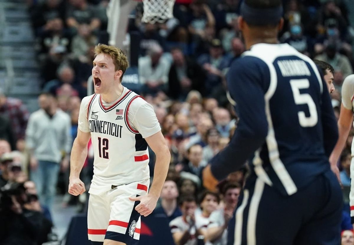 Feb 6, 2024; Hartford, Connecticut, USA; UConn Huskies guard Cam Spencer (12) reacts after his three point basket against the Butler Bulldogs in the first half at XL Center.