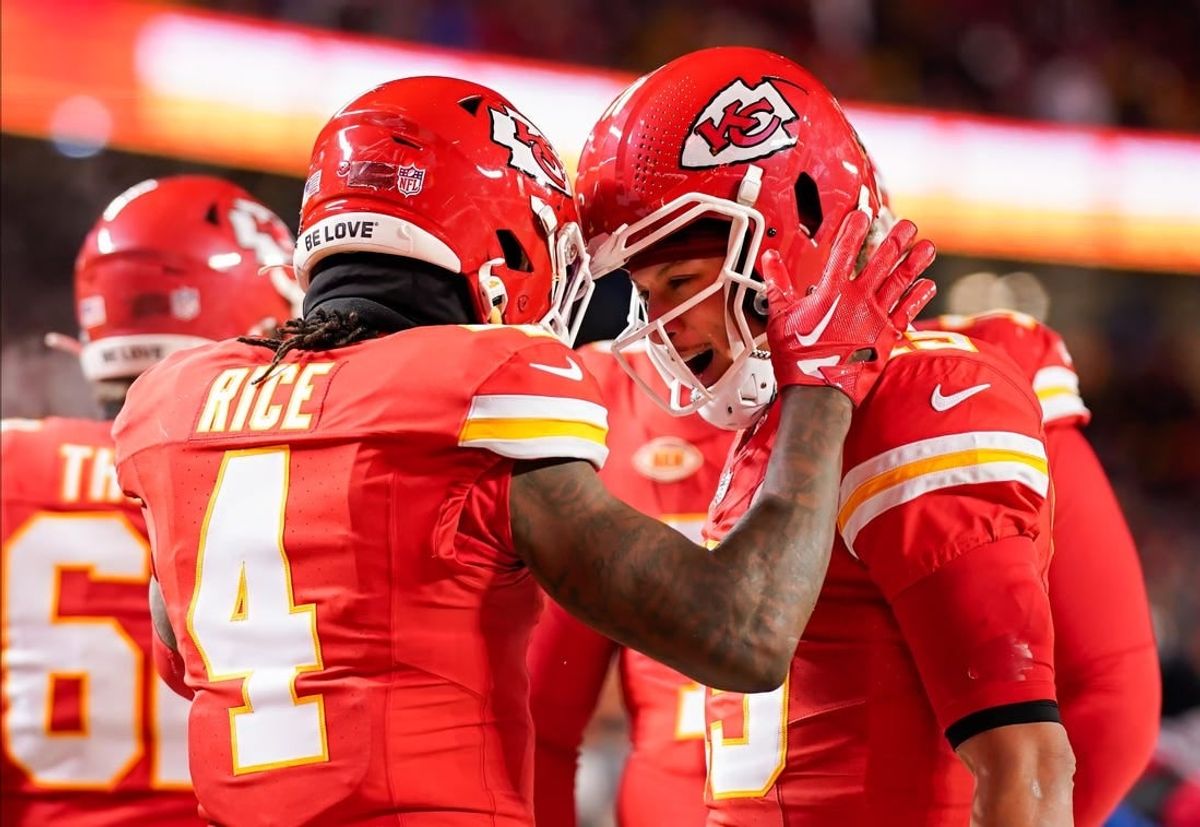 Kansas City Chiefs quarterback Patrick Mahomes (15) celebrates with wide receiver Rashee Rice (4) during the first half of a 2024 AFC wild card game against the Miami Dolphins at GEHA Field at Arrowhead Stadium.