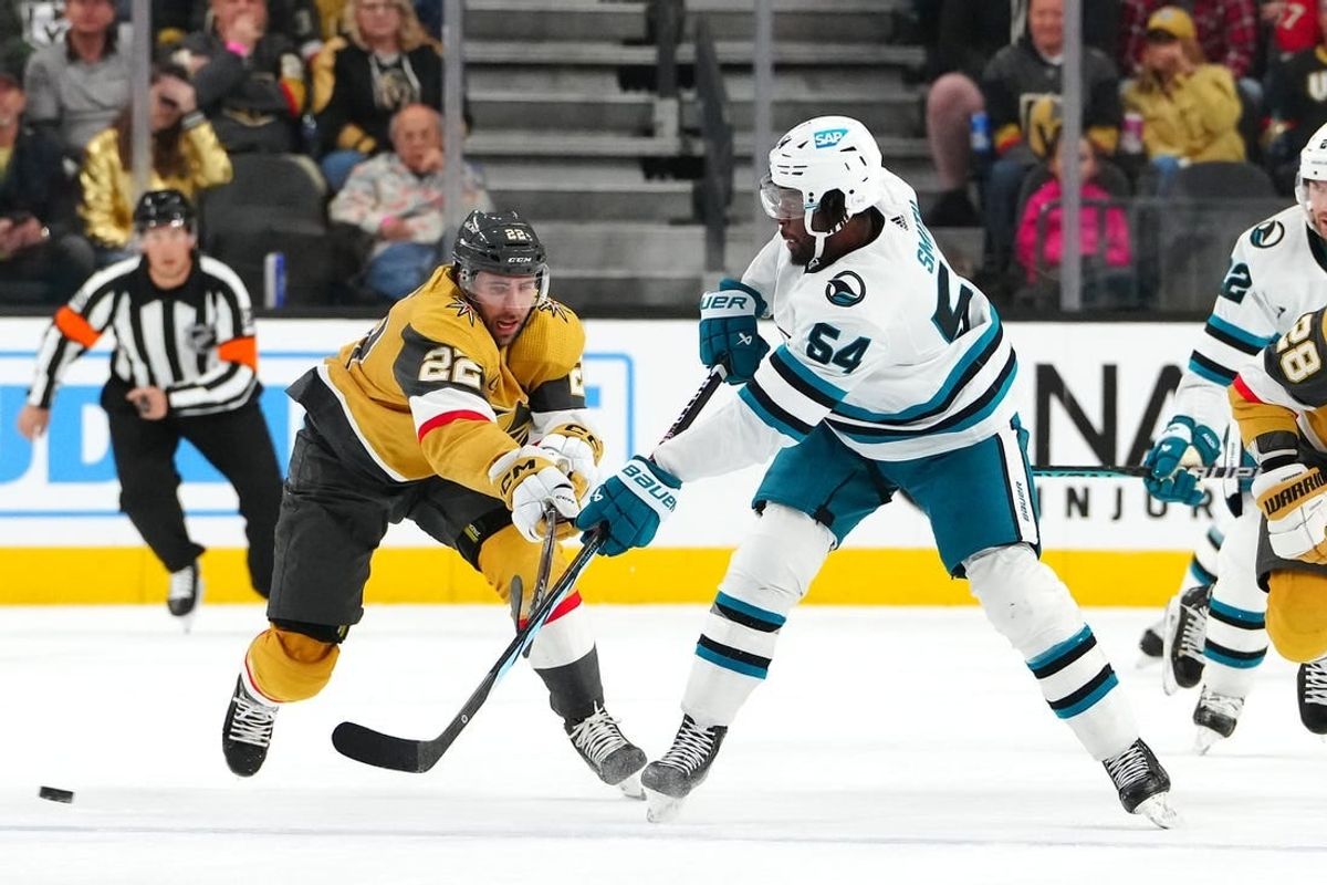 Nov 10, 2023; Las Vegas, Nevada, USA; San Jose Sharks right wing Givani Smith (54) makes a pass in front of Vegas Golden Knights right wing Michael Amadio (22) during the first period at T-Mobile Arena.