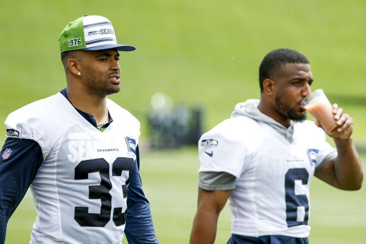 Jun 7, 2022; Renton, Washington, USA; Seattle Seahawks strong safety Jamal Adams (33) and free safety Quandre Diggs (6) walk on the field during minicamp practice at the Virginia Mason Athletic Center Field.