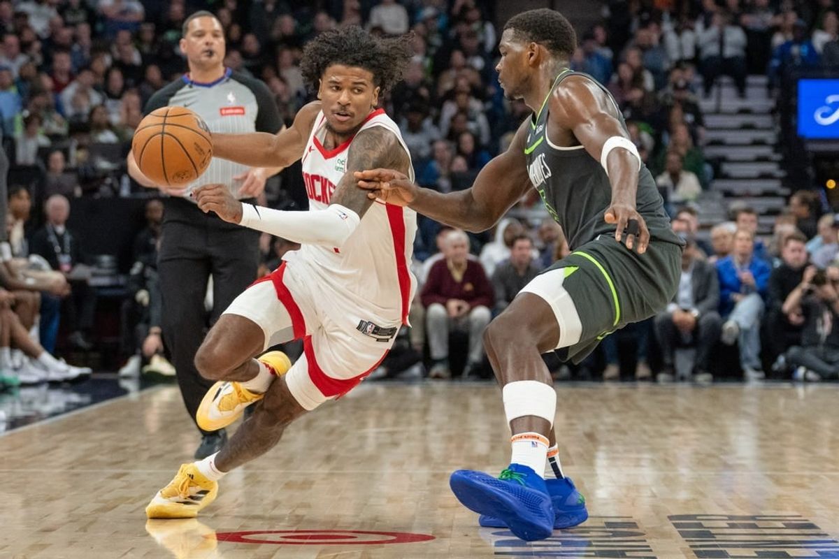 Apr 2, 2024; Minneapolis, Minnesota, USA; Houston Rockets guard Jalen Green (4) drives on Minnesota Timberwolves guard Anthony Edwards (5) in the third quarter at Target Center.