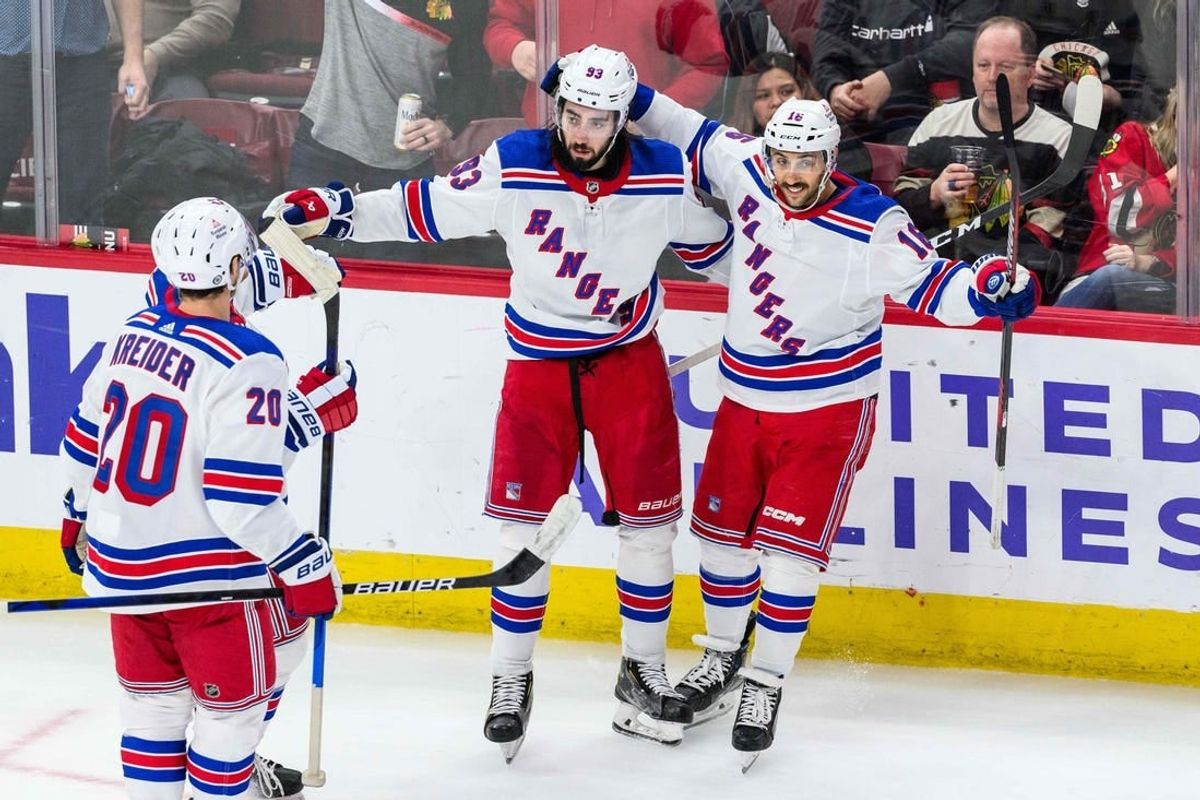 Feb 9, 2024; Chicago, Illinois, USA; New York Rangers center Mika Zibanejad (93) celebrates his goal with teammates against the Chicago Blackhawks during overtime at the United Center.