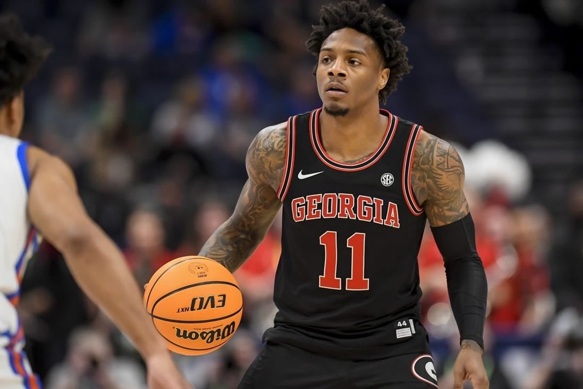 Mar 14, 2024; Nashville, TN, USA;  Georgia Bulldogs guard Justin Hill (11) dribbles against the Florida Gators during the first half at Bridgestone Arena.